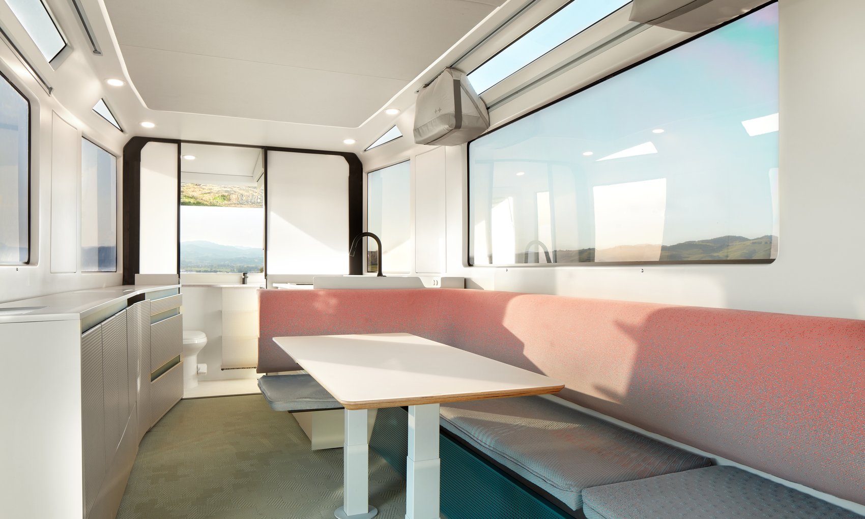 The spacious, light-filled L1 interior has hidden custom ducting behind the seating and storage consoles that provides a better experience